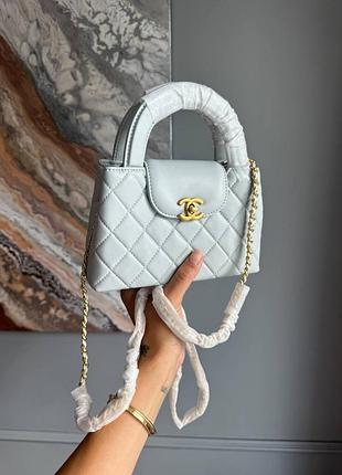 Жіноча сумка преміум top handle flap bag in light blue quilted leather with gold-tone hardware