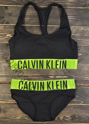 Женский комплект нижнего белья calvin klein (топ + слипы) коллекция intense, цвет черный c розовой резинкой