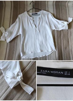 Белая блуза с бантами на рукавах