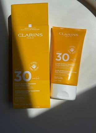 Сонцезахисний крем для тіла clarins youth-protecting sunscreen spf 30 повний формат 150мл