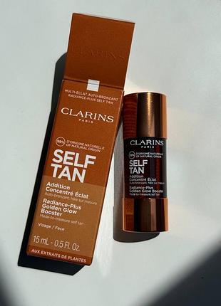 Концентрат з ефектом штучної засмаги для обличчя clarins radiance-plus golden glow booster повний формат 15ml