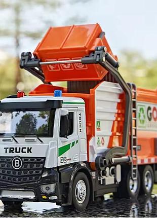 Сміттєвоз із електричним механізмом завантаження. 1:18 звук, світло, аксесуари. оранжевий