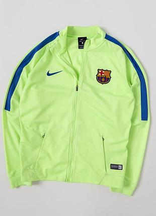 Дитяча, спортивна олімпійка nike x fc barcelona у яскравому, салатовому кольорі. модель виконана в клубному стилі з емблемою «барселони» та логотипом
