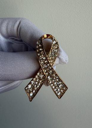 Металева брошка  стрічка з кристалами «crystal ribbon» у золотистому кольорі