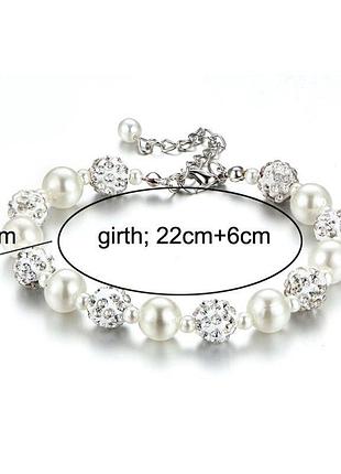 Браслет з перлинками та шармами