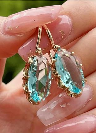 Сережки жовтого кольору з блакитним каменем