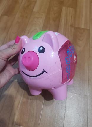 Розвивальна іграшка свинка скарбничка з монетками від fisher-price