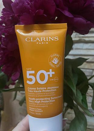 Сонцезахисний крем для тіла clarins youth-protecting sunscreen spf 50+,