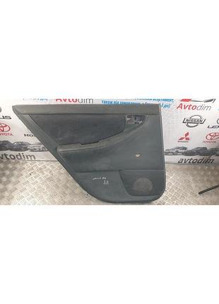 Панель обивки задних дверей левая 6764013850b0 toyota corolla e120 хэтчбек rhd