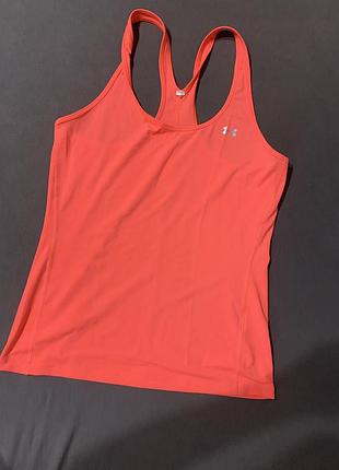 Жіноча спортивна майка under armour яскравого коралово-помаранчевого кольору, модель якої відповідає лінійці ua heatgear armour racer tank