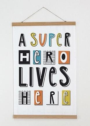 Тканинний постер на стіну a super hero lives here