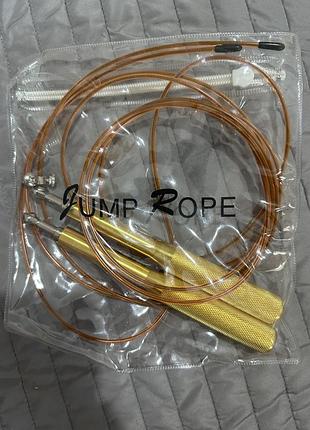 Скакалка jump rope з золотими ручкам, нова