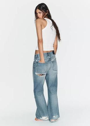 Трендові джинси zara з розрізом позаду та потертостями розмір 32