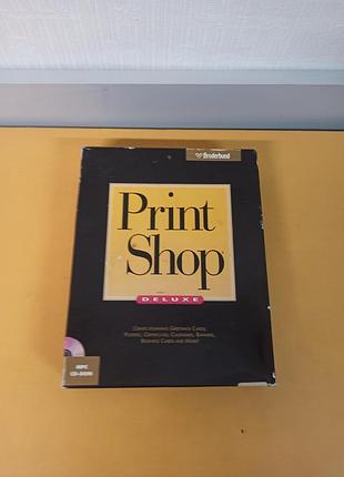 Коробка з програмним забезпеченням the print shop deluxe ii від компанії broderbund.