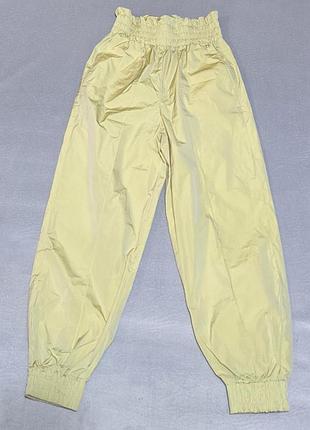 Нейлоновые брюки-джоггеры от бренда versace jeans couture. р. s