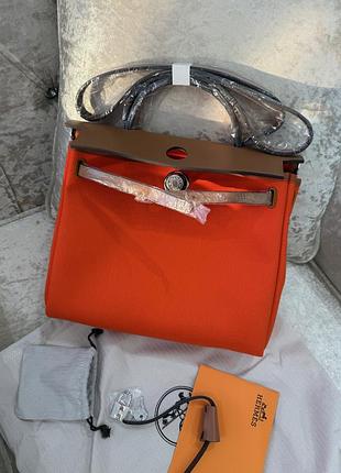 Шкіряна сумка з текстилем помаранчева herbag 31 cm