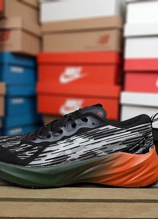 Кросівки asics novablast 3 чорні з білим та помаранчевим