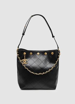 Сумка шанел quilted drawstring bag in black/gold