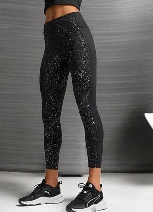 Жіночі спортивні блискучі легінси puma intergalactic high-waist 7/8 tights у чорному кольору