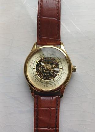 Механічний чоловічий годинник skeleton у золотистому корпусі