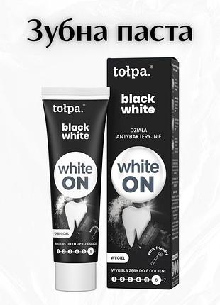 Tołpa white on black white — антибактеріальна зубна паста з активованим вугіллям