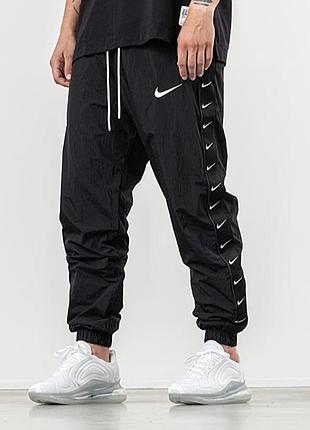 Спортивні штани nike sportswear swoosh woven pants (артикул: cd0421-010)