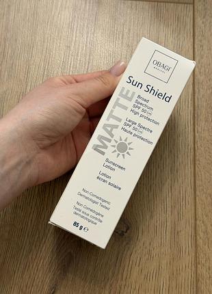 Сонцезахисний лосьйон obagi medical sun shield matte broad spectrum spf 50 об'ємом 85 г.