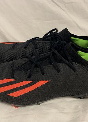 Футбольні бутси adidas x speedportal.3 fg чорного кольору з яскраво-червоними акцентами.