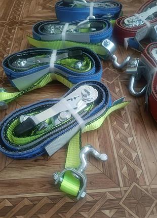 Стяжні ремені для кріплення автомобілів на евакуаторах або лафетах, які зазвичай мають вантажопідйомність від 1.5 до 3 тонн.