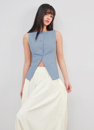 Приталена блакитна желетка розмір с zara