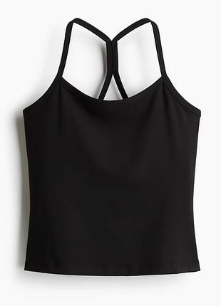 Спортивний топ від h&m має функціональну тканину softmove™ та вбудований бюстгальтер для підтримки.