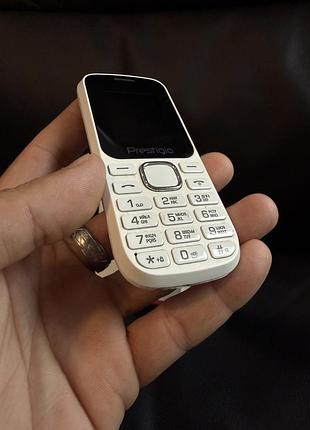Кнопочний телефон prestigio wize b1.    *4458 6