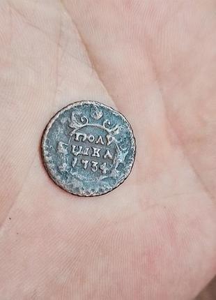 Монета полушка 1734 року