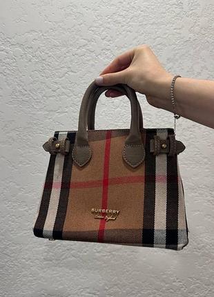 Сумка в стилі burberry. нова, містка, з довгим ремінцем. є незначний дефект на ручках (видно на фото), в іншому ідеальний стан.