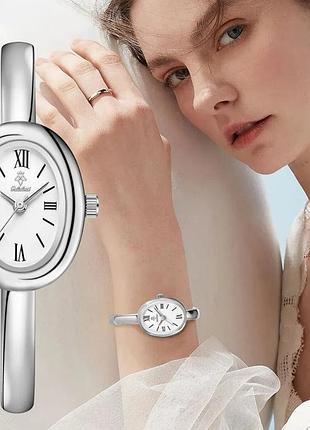 Годинник жіночий yalalusi bagnuar (silver-white).
витончений жіночий годинник із стильним овальним корпусом сріблястого кольору та  білим циферблатом