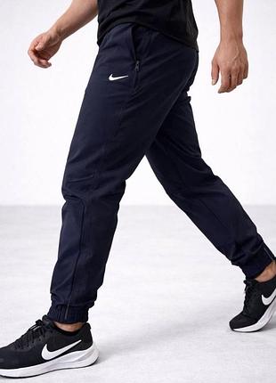 Стильні чоловічі спортивні штани nike з якісної плащової тканини на підкладці хб.