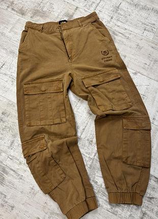 Stüssy vintage tribe cargo pants коричневі горчичні карго штани s-m відмінний стан