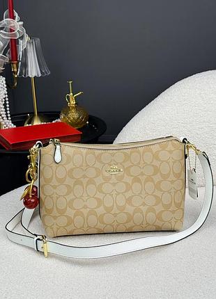 Жіноча сумка coach signature canvas shoulder bag бежева