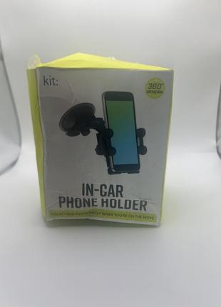 Автомобільний тримач для телефону бренду kit у жовто-білому пакуванні.