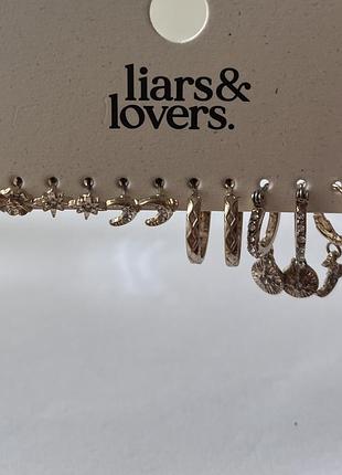 Liars & lovers.тип: набір золотистих сережок-кілець, включаючи пусети та кафи