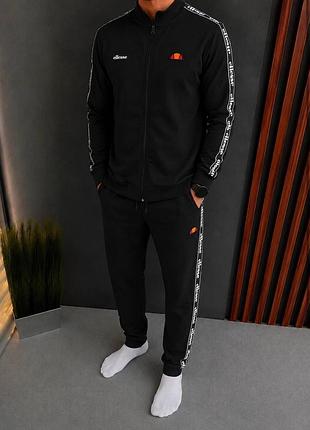 Чорний чоловічий спортивний костюм з лампасами ellesse