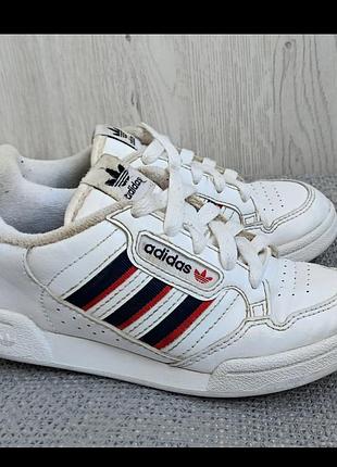 Білі дитячі кросівки adidas continental