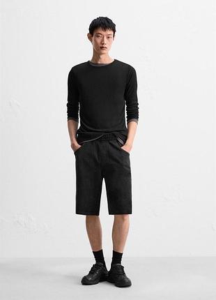 Baggy fit колір: чорний шорти-бермуди з еластичним поясом і внутрішніми шнурками для регулювання. кишені спереду та накладна ззаду.