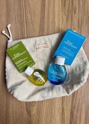 Парфуми  від clarins і косметичка