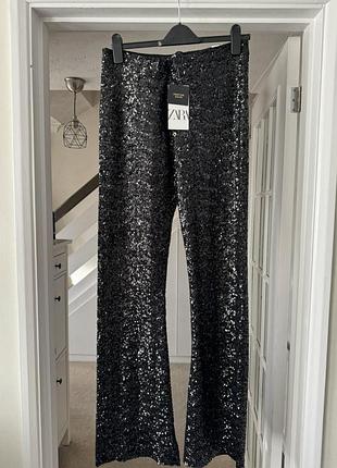 Брюки з чорних паєток zara