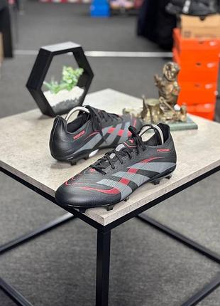 Футбольні бутси adidas predator league у кольорі core black / grey four / lucid red із серії stealth victory pack.