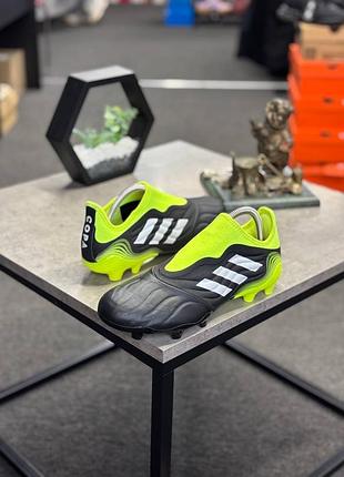 Футбольні бутси adidas copa sense.3 ll fg у чорному кольорі з яскраво-жовтим (solar yellow) текстильним носком без шнурків.