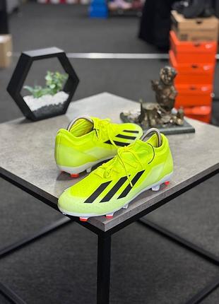 Футбольні бутси adidas x crazyfast league fg (артикул ig0605 / if0691) яскраво-жовтого кольору з чорними фірмовими смужками.
