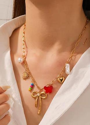 Кольє з нержавіючої сталі «bonbon charm» з золотистим бантом