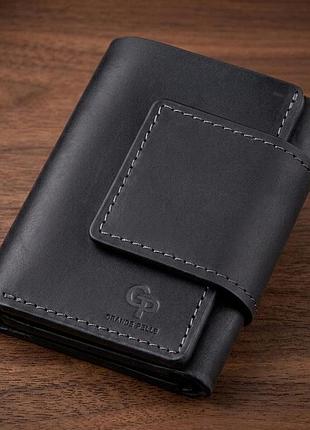 Суворе компактне портмоне унісекс на магніті grande pelle 11204 чорне